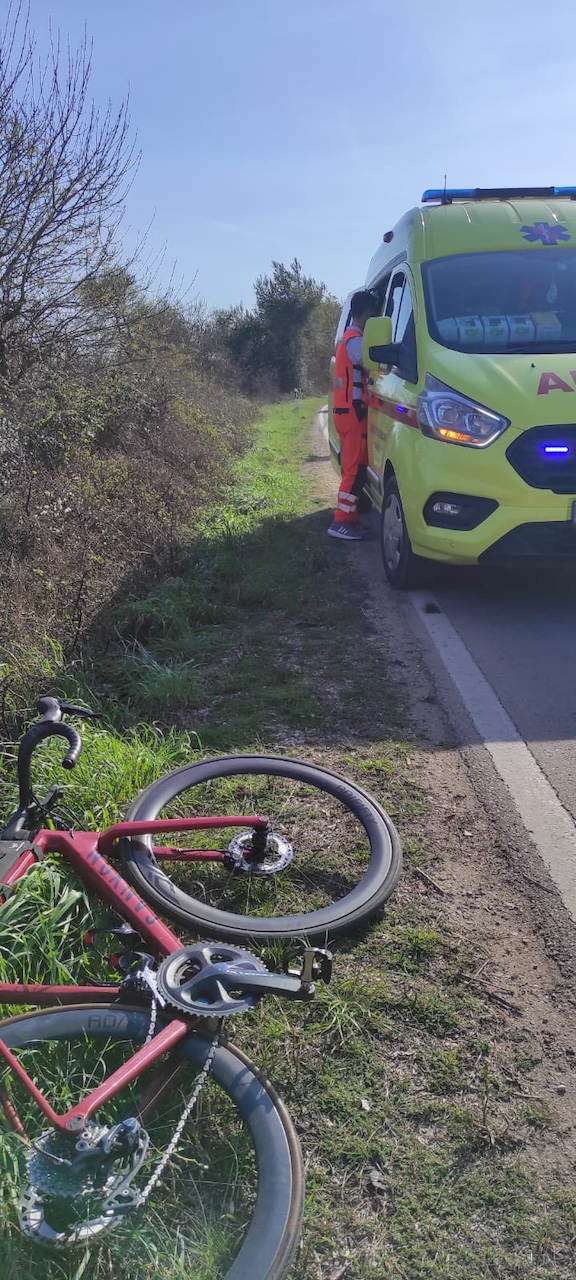My broken bike in the front, and broken body in the ambulance
